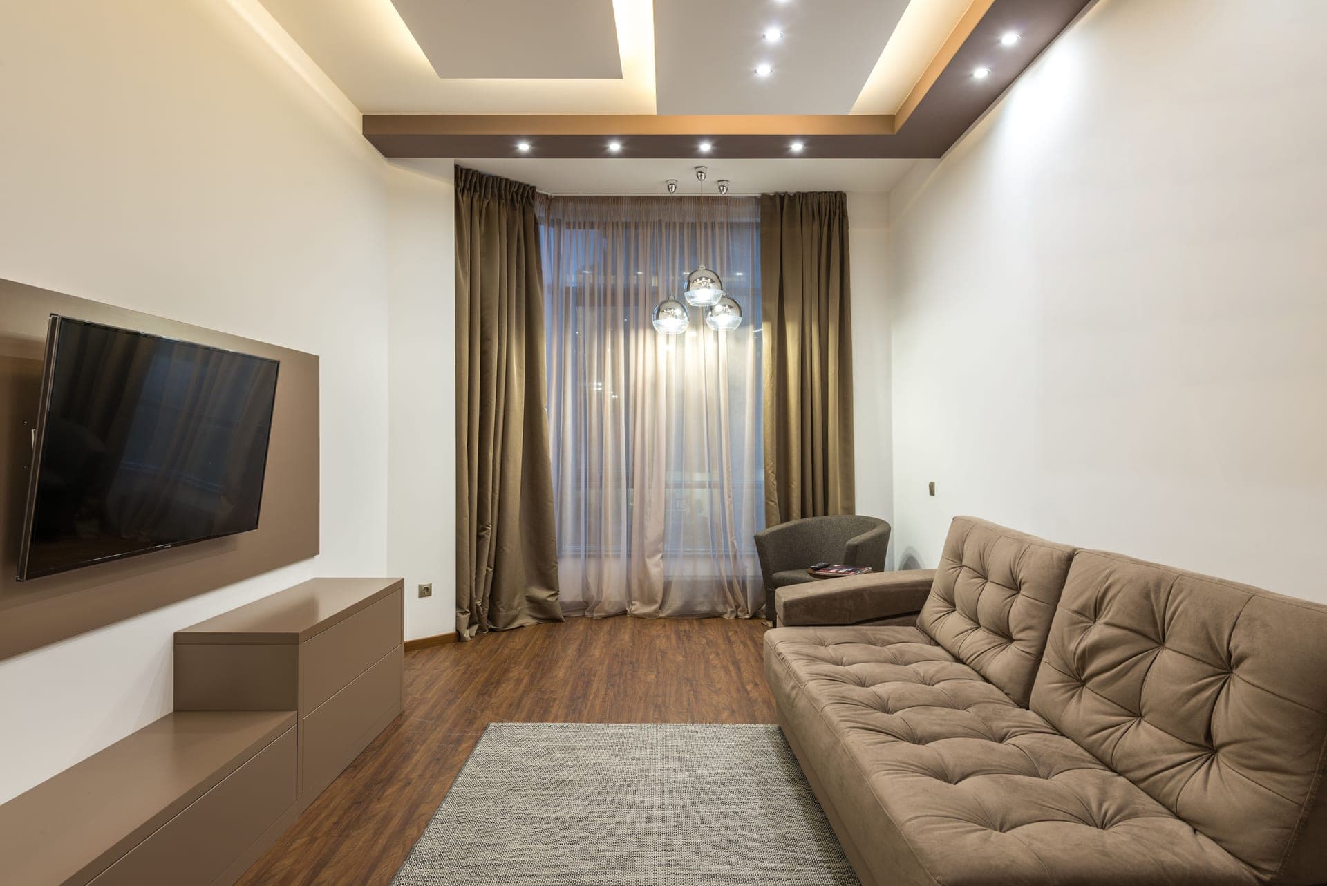 A living room ceiling fitted with recessed downlights