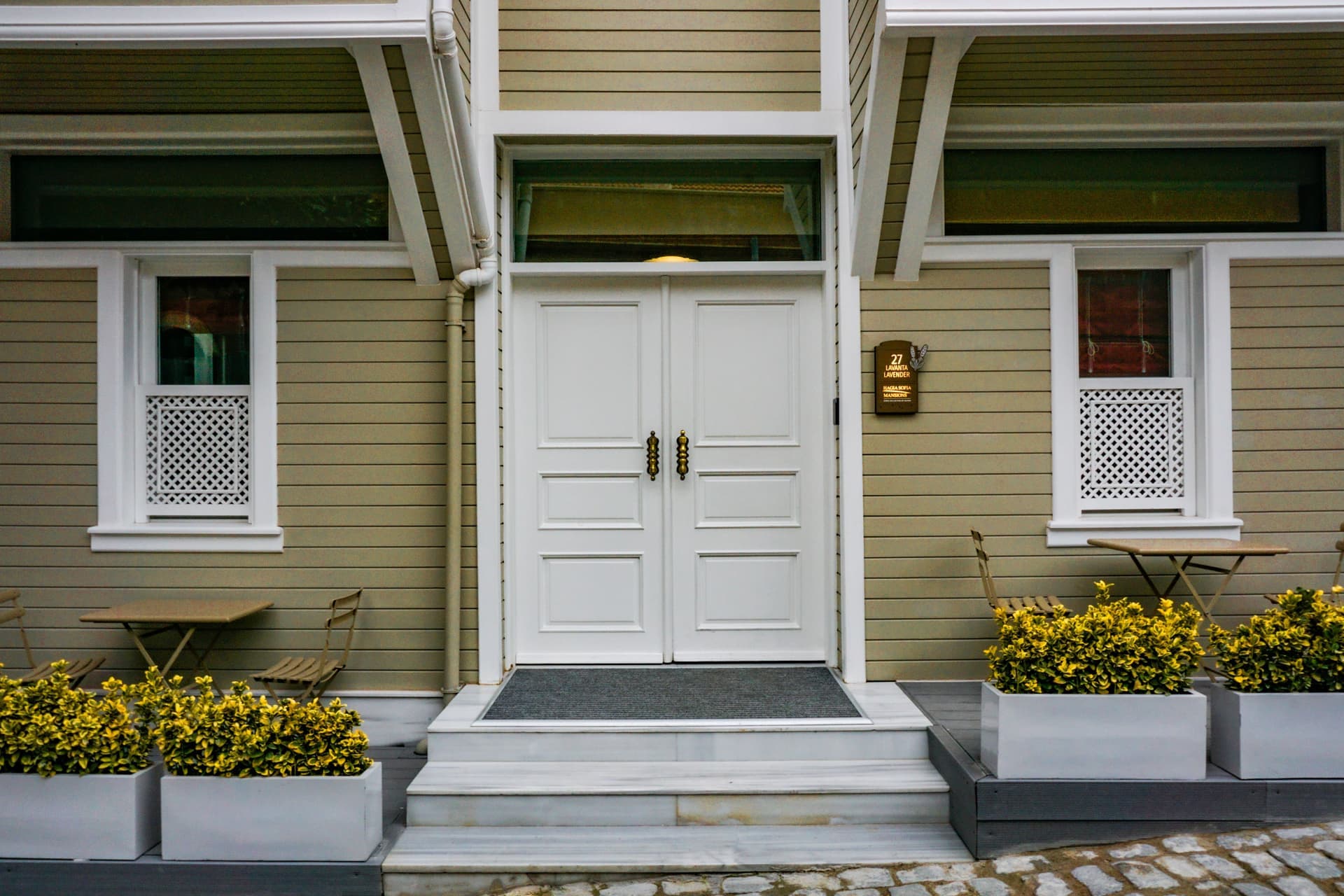 A closed interior door meeting a hard floor with no visible gap