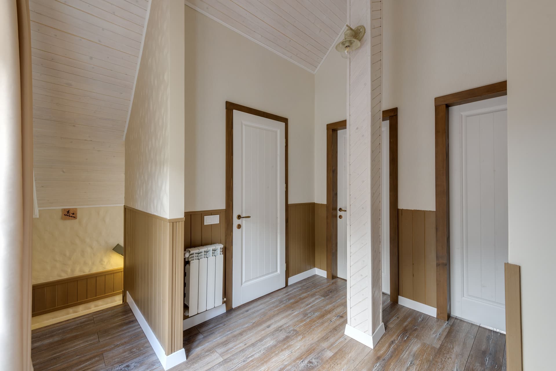 A fabric draft stopper tube pressed against the bottom of an interior door