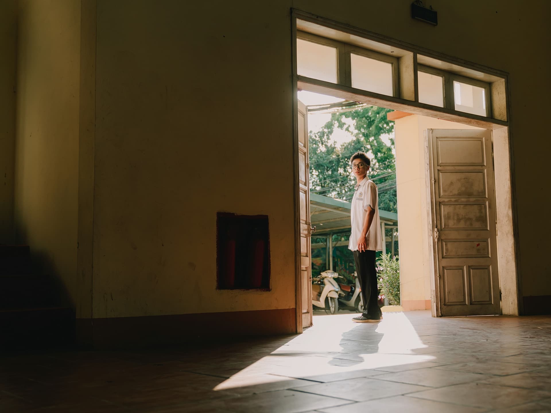 Daylight visible through the gap under a closed exterior door, seen from inside at floor level