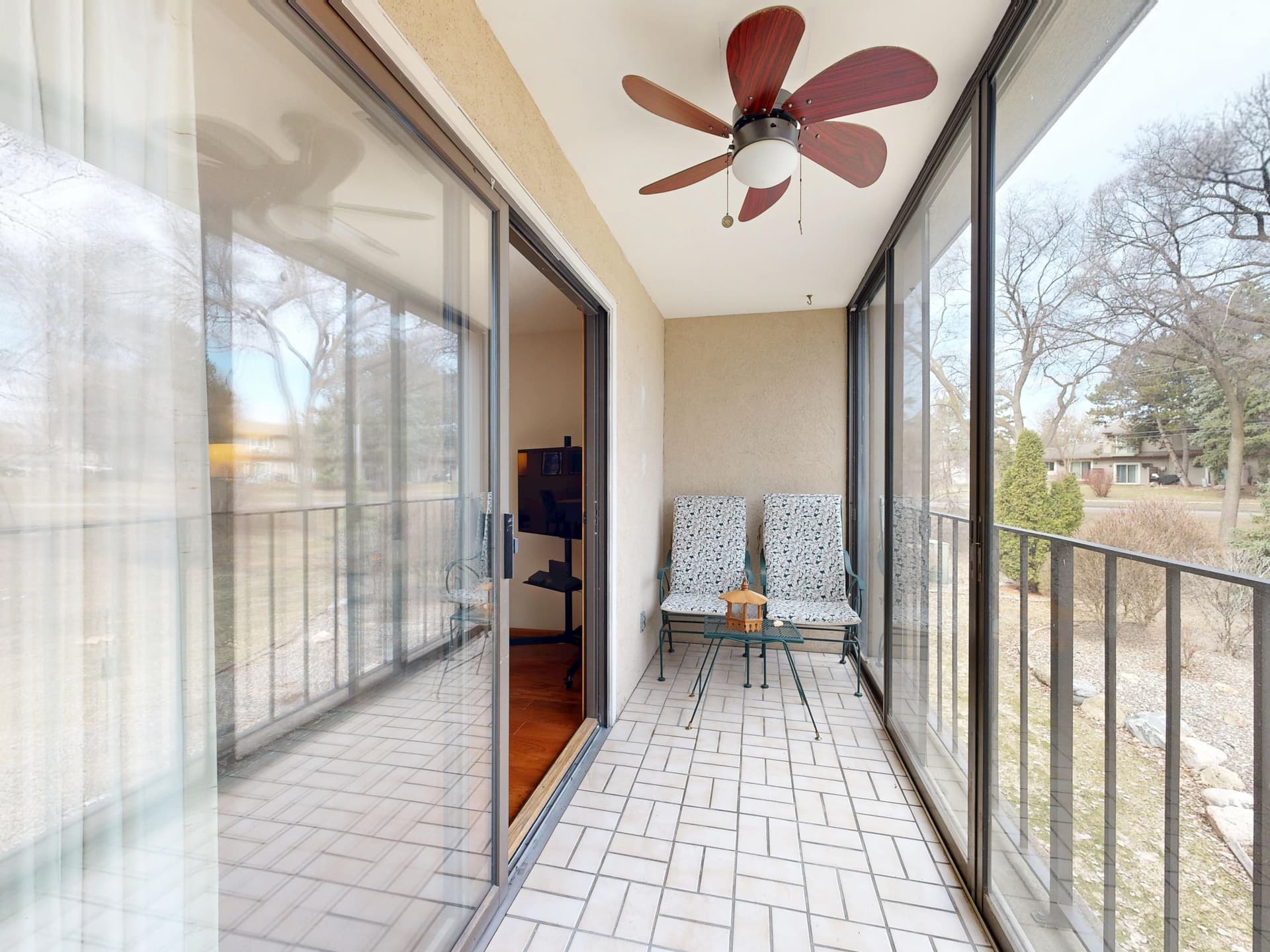 A sliding glass patio door opening onto a balcony
