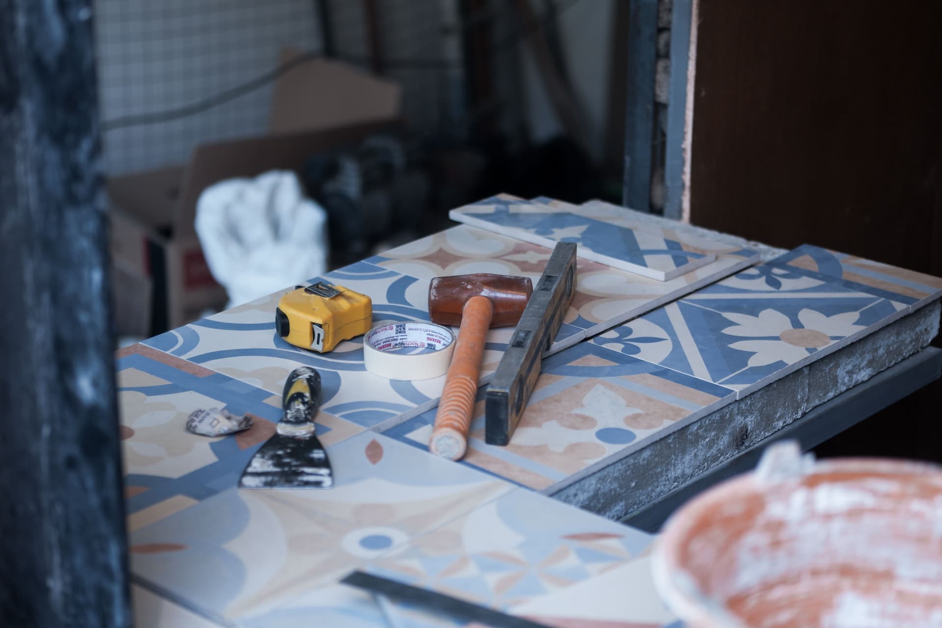 Sealant cartridges and application tools laid out on a work surface